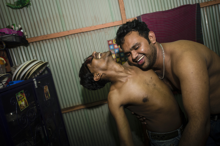 Roni and Saddam are dancing in the Kandapara brothel in Tangail. Both are shop owners and sons of sexworkers.