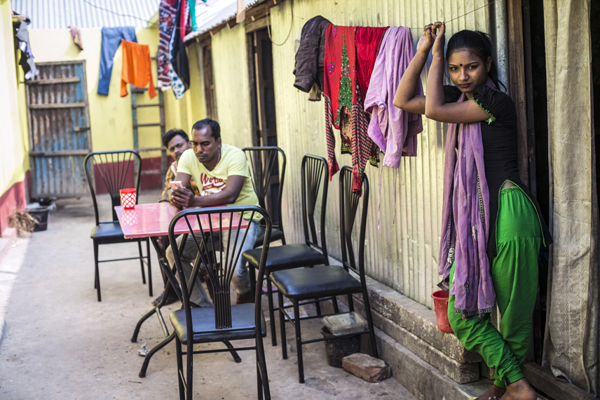 Sumaiya, 17, in front of her room in the Kandapara brothel in Tangail. She works as a sex worker since two years.